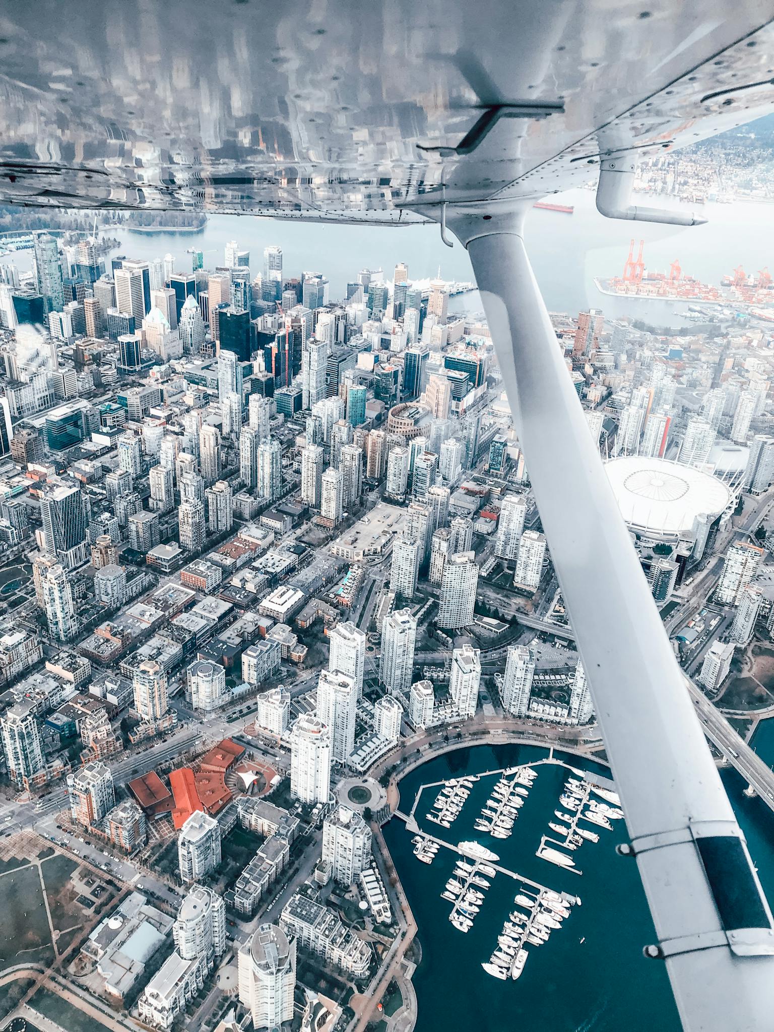 Stunning aerial perspective of downtown Vancouver's skyline and harbor.